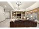 Spacious basement with custom built-ins, a large screen TV, neutral colors, and bright lights at 5120 Parkwood Oaks Ln, Smyrna, GA 30126