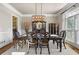 Formal dining room with dark wood table, ornate chairs, and a decorative chandelier at 5120 Parkwood Oaks Ln, Smyrna, GA 30126