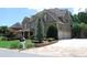 Charming home with a lush lawn, complemented by a well-manicured landscape and a convenient three-car garage at 5120 Parkwood Oaks Ln, Smyrna, GA 30126