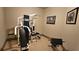 A home gym with exercise equipment and framed art provides a dedicated space for fitness at 5120 Parkwood Oaks Ln, Smyrna, GA 30126