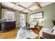 Sophisticated living area with a decorative bar, hardwood floors, and a striking coffered ceiling at 5120 Parkwood Oaks Ln, Smyrna, GA 30126