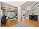 Elegant sitting room with coffered ceilings, hardwood floors, and tasteful decor, adjacent to foyer at 5120 Parkwood Oaks Ln, Smyrna, GA 30126