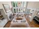 Bright living room with high ceilings, lots of natural light, fireplace, and comfortable seating at 5120 Parkwood Oaks Ln, Smyrna, GA 30126