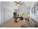 Bright office with a ceiling fan, natural light, built-in shelving, and a comfortable sofa at 5120 Parkwood Oaks Ln, Smyrna, GA 30126