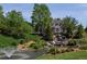 Beautiful community water feature with stone waterfall and lush landscaping at 5120 Parkwood Oaks Ln, Smyrna, GA 30126