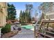 Inviting backyard with a swimming pool, hot tub, lounge chairs, and pergola for entertainment and outdoor enjoyment at 5120 Parkwood Oaks Ln, Smyrna, GA 30126