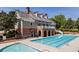 A Community Swimming Pool With a Large Pool and a Baby Pool and Seating Area at 5120 Parkwood Oaks Ln, Smyrna, GA 30126