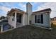 Side view of a charming home with a chimney and tidy yard at 5778 Eagles Feather Ln, Riverdale, GA 30274