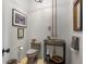 Unique powder room featuring a stone sink and rustic design elements at 7455 Old Rico Rd, Chattahoochee Hills, GA 30268