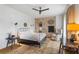 Cozy bedroom featuring a comfortable bed, brick accent wall, and beautiful natural light at 7455 Old Rico Rd, Chattahoochee Hills, GA 30268