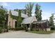 Charming home with a greenhouse addition, vine covered walls and mature landscaping at 7455 Old Rico Rd, Chattahoochee Hills, GA 30268