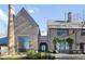 Beautiful home exterior with brick, unique architecture, and manicured landscaping at 7455 Old Rico Rd, Chattahoochee Hills, GA 30268