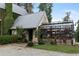 Charming home with a greenhouse addition and lush greenery at 7455 Old Rico Rd, Chattahoochee Hills, GA 30268
