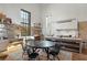 Bright open kitchen with a large window view, an island and an eating nook at 7455 Old Rico Rd, Chattahoochee Hills, GA 30268