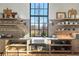 Bright kitchen with a large window and shelving with an open view to the backyard at 7455 Old Rico Rd, Chattahoochee Hills, GA 30268