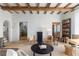 Cozy living room featuring a fireplace, stone floors, and rustic accents at 7455 Old Rico Rd, Chattahoochee Hills, GA 30268