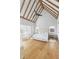 Spacious main bedroom boasts vaulted ceilings, wood floors, and oversized windows showcasing beautiful views at 7455 Old Rico Rd, Chattahoochee Hills, GA 30268