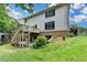 Spacious backyard with walkout basement, patio and deck is enhanced by mature trees and offers many outdoor opportunities at 3305 Suffolk Dr, Cumming, GA 30041