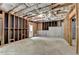 Unfinished basement showing framed walls and concrete floor ready for your personalization and offering potential for various uses at 3305 Suffolk Dr, Cumming, GA 30041