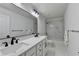 Modern bathroom with double sinks, white cabinets and marble-look tile at 3305 Suffolk Dr, Cumming, GA 30041