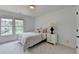 Sunlit bedroom with large window and comfortable decor at 3305 Suffolk Dr, Cumming, GA 30041
