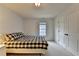 Cozy bedroom with a comfortable bed and plenty of natural light at 3305 Suffolk Dr, Cumming, GA 30041