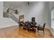 Bright dining room boasts hardwood floors, elegant lighting, and an expansive table for gatherings at 3305 Suffolk Dr, Cumming, GA 30041