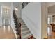 Welcoming entryway with staircase and hardwood floors at 3305 Suffolk Dr, Cumming, GA 30041