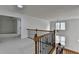Upstairs hallway with wood and iron railing and large windows at 3305 Suffolk Dr, Cumming, GA 30041