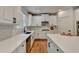 Modern kitchen with white cabinets, quartz countertops and stainless steel appliances at 3305 Suffolk Dr, Cumming, GA 30041