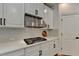 New kitchen featuring stainless steel range hood and subway tile backsplash at 3305 Suffolk Dr, Cumming, GA 30041