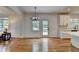Bright, transitional space that connects the living room and kitchen, featuring new lighting and hardwood floors at 3305 Suffolk Dr, Cumming, GA 30041