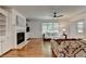 Beautiful living room with a fireplace, built in shelves and large windows to let in natural light at 3305 Suffolk Dr, Cumming, GA 30041