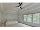 Spacious main bedroom with tray ceilings, fan, and large windows at 3305 Suffolk Dr, Cumming, GA 30041