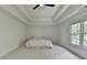 Spacious main bedroom with tray ceilings, fan, and large windows at 3305 Suffolk Dr, Cumming, GA 30041