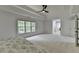 Spacious main bedroom with tray ceilings, fan, and large windows at 3305 Suffolk Dr, Cumming, GA 30041