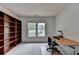 Bright office space featuring built-in bookshelves and a large window at 3305 Suffolk Dr, Cumming, GA 30041