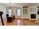 View of a large open concept space with a fireplace and office area featuring hardwood flooring at 3305 Suffolk Dr, Cumming, GA 30041