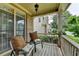 Relaxing porch features comfortable seating, brick detailing, and a view of the neighborhood at 3305 Suffolk Dr, Cumming, GA 30041