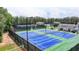 Community tennis courts with well-maintained courts surrounded by lush greenery offer a recreational and active lifestyle at 3305 Suffolk Dr, Cumming, GA 30041