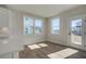 Sunny breakfast nook with plank flooring, a door to the backyard, and oversized windows at 3941 Adler Cir, Buford, GA 30519