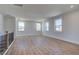 Open loft with hardwood flooring and natural light from three large windows at 3941 Adler Cir, Buford, GA 30519