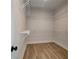 Spacious walk-in closet with wood floors and wire shelving for ample storage at 3941 Adler Cir, Buford, GA 30519