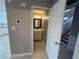 View into bathroom showcasing vanity with mirror and lighting with neutral-colored walls and tile flooring at 3954 Lullwater Main Nw, Kennesaw, GA 30144