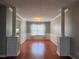 Bright dining room with hardwood floors, modern trim, and decorative columns at 3954 Lullwater Main Nw, Kennesaw, GA 30144