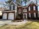 Charming two-story home featuring a brick facade and two-car garage at 3954 Lullwater Main Nw, Kennesaw, GA 30144