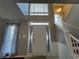 Bright foyer with high ceilings and a staircase, showcasing the home's entrance at 3954 Lullwater Main Nw, Kennesaw, GA 30144