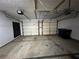 Spacious two-door garage with storage racks, offering ample room for vehicles and organizational possibilities at 3954 Lullwater Main Nw, Kennesaw, GA 30144