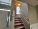 Beautiful staircase with wood steps and white railings leading to the upper level at 3954 Lullwater Main Nw, Kennesaw, GA 30144