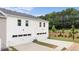 Rear view of newly constructed townhomes with spacious two-car garages at 440 Reflection Dr # 16, Stockbridge, GA 30281